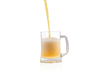 Beer pouring into half full glass isolated over white background