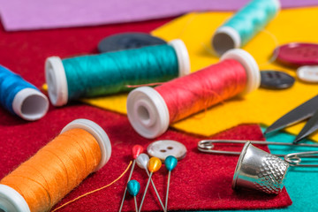 Various sewing accessories on a colored felt.