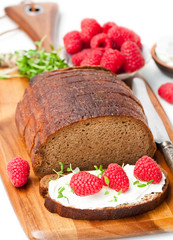 Traditional  black rye bread with raspberries and thyme and soft