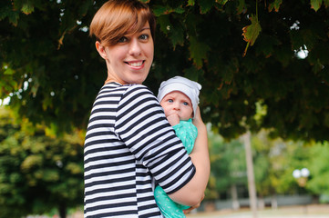 Mother with newborn daughter in park