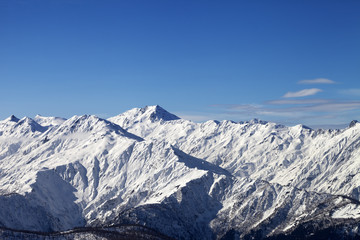 Fototapeta na wymiar View on snowy mountains in sunny day