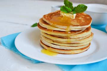 Pancakes for breakfast with butter and honey