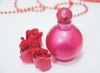 perfume bottle and roses