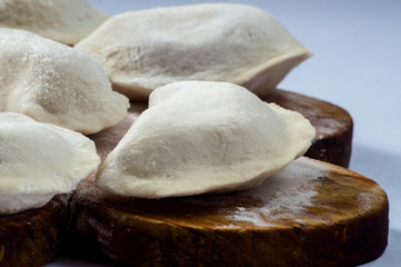 Dumplings are hired prepared for cooking in hot water