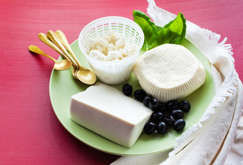 Ricotta, Feta and sheep Cheese.  group of white cheeses on the a
