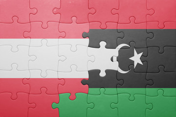 puzzle with the national flag of austria and libya