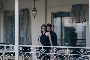Fototapeta na wymiar Beautiful couple on balcony