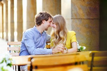 Young couple in the outdoor cafe