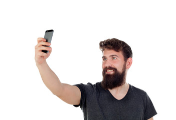 Handsome boy with long beard and a mobile