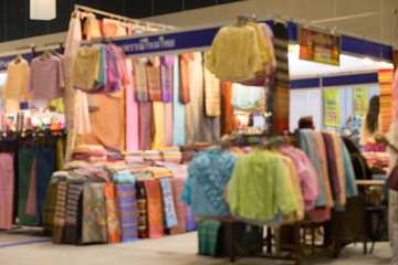 Fototapeta na wymiar colorful woman cloth selling in shop (blur background)