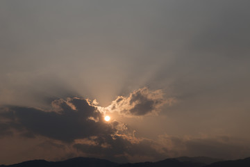 view of sun and mountain at dusk