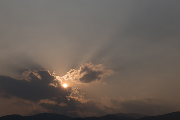 view of sun and mountain at dusk