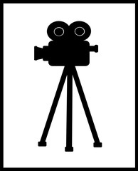 vintage film movie camera on tripod