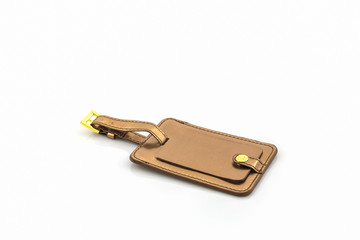 Golden leather luggage tag.