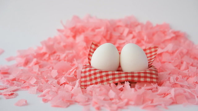 White Easter Eggs On A Pink Background
