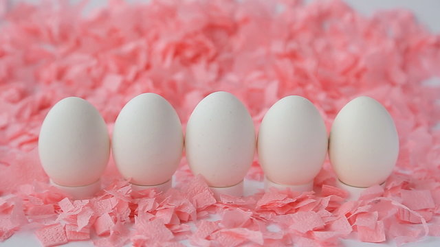 White Easter Eggs On A Pink Background
