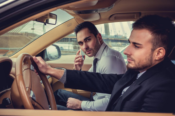 Two modern guys in the car.