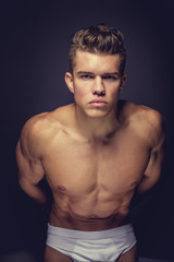 Fototapeta premium A man model in a white panties.