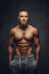 Obraz na płótnie Canvas Shirtless muscular man with beard.