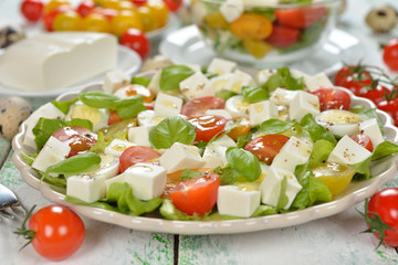 Vegetarian salad with cherry tomatoes, eggs and cheese