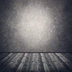 Abandoned old room with concrete wall and wooden floor