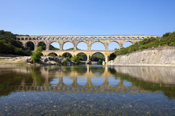 Fototapeta premium Three-tiered aqueduct Pont du Gard was built in Roman times on the river Gardon - France