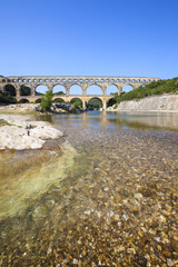 Three-tiered aqueduct Pont du Gard was built in Roman times on the river Gardon - France