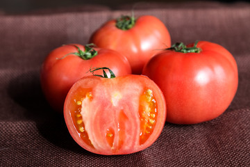 fresh tomatoes with green leaves