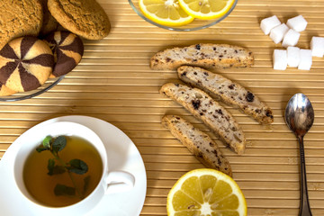 tea with mint, cookies and lemon