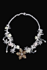 necklace on a black background in close up. beaded necklace