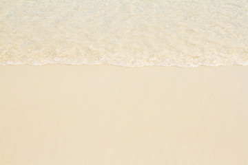 Fototapeta na wymiar Wave of the sea and sandy beach.