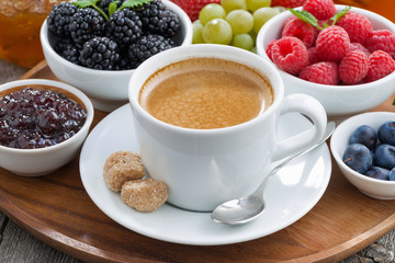 Breakfast with coffee and fresh berries, close-up