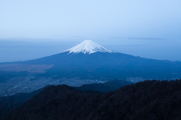 Fototapeta premium View of Mountain Fuji and Fujiyoshida town seen from Mountain Mitsutoge