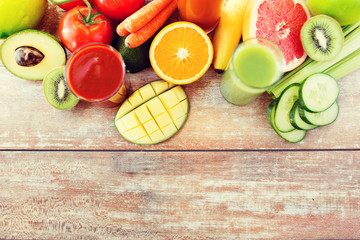 close up of fresh juice glass and fruits on table
