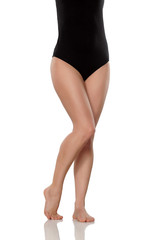 female legs and black bodysuit