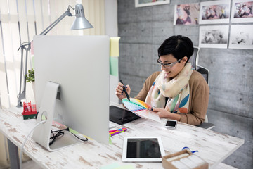 woman designer chooses color palette .
