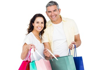 Attractive couple holding shopping bags