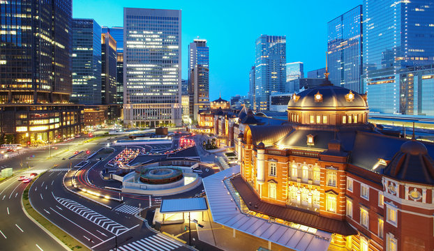 Tokyo railway station and Tokyo highrise building at twilight time