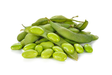 boiled green soybeans on white background