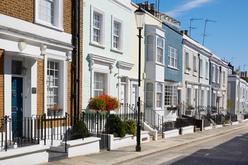 Colorful English houses facades in a sunny day in London - obrazy, fototapety, plakaty