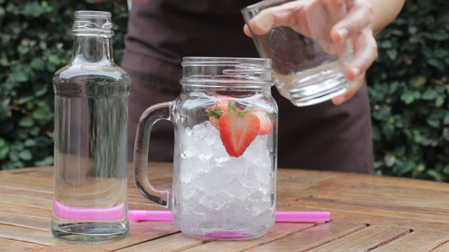 Strawberry infused water easy drink, stock video