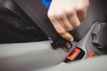 Man buckling his seatbelt