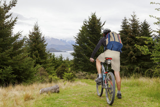 Mountain Bike Rider At Lake Wanaka, New Zealand