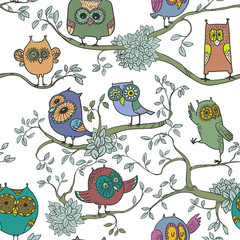 Cute seamless background with owls