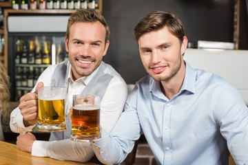 Men toasting with beers