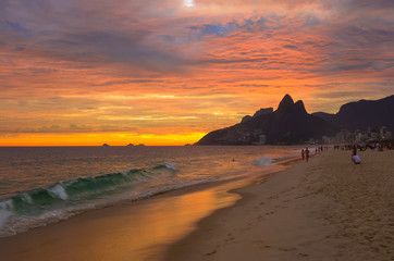 Fototapeta na wymiar Sunset view of Ipanema beach and mountain Dois Irmao (Two Brother) in Rio de Janeiro, Brazil