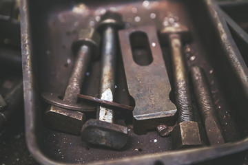 Old rusty bolts and steel nuts