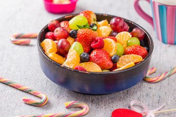dish full various fresh colorful fruits