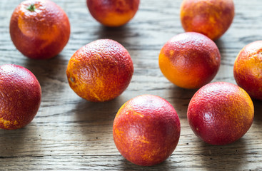 Red tangerines on the wooden background