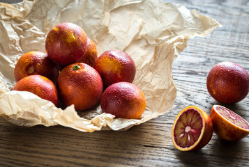 Red tangerines on the wooden background